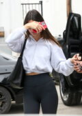 Kendall Jenner dons a cropped white hoodie and black leggings while  visiting Kate Somerville Skincare clinic