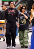 Kourtney Kardashian wears an oversized tee and baggy cargo pants while out for a stroll with Travis Barker in New York City
