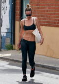 Olivia Wilde shows off her rock hard abs in a sports bra and leggings while  leaving