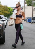 Olivia Wilde shows off her rock hard abs in a sports bra and leggings while  leaving