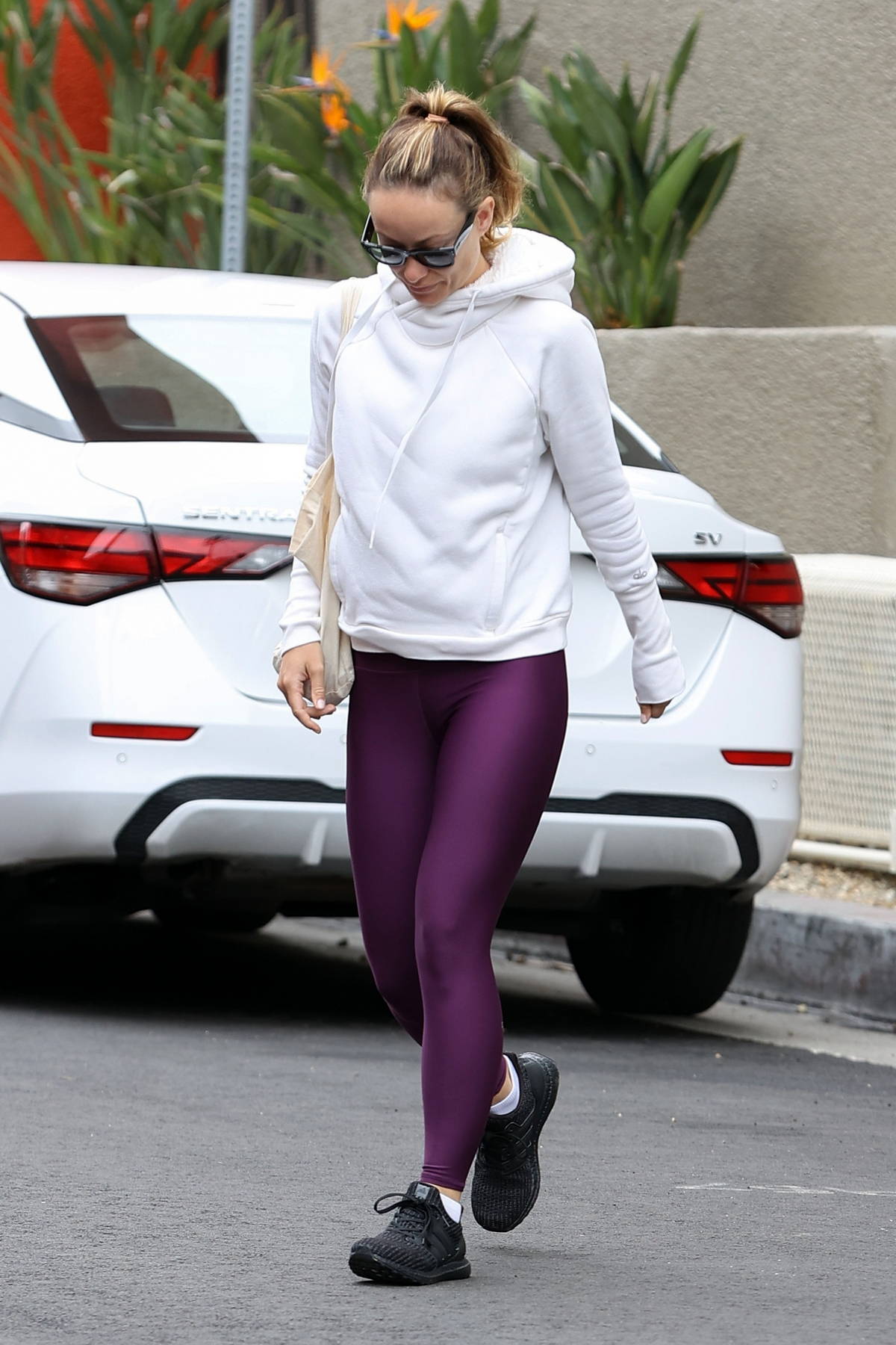 Olivia Wilde shows off her rock-hard abs in purple sports bra and