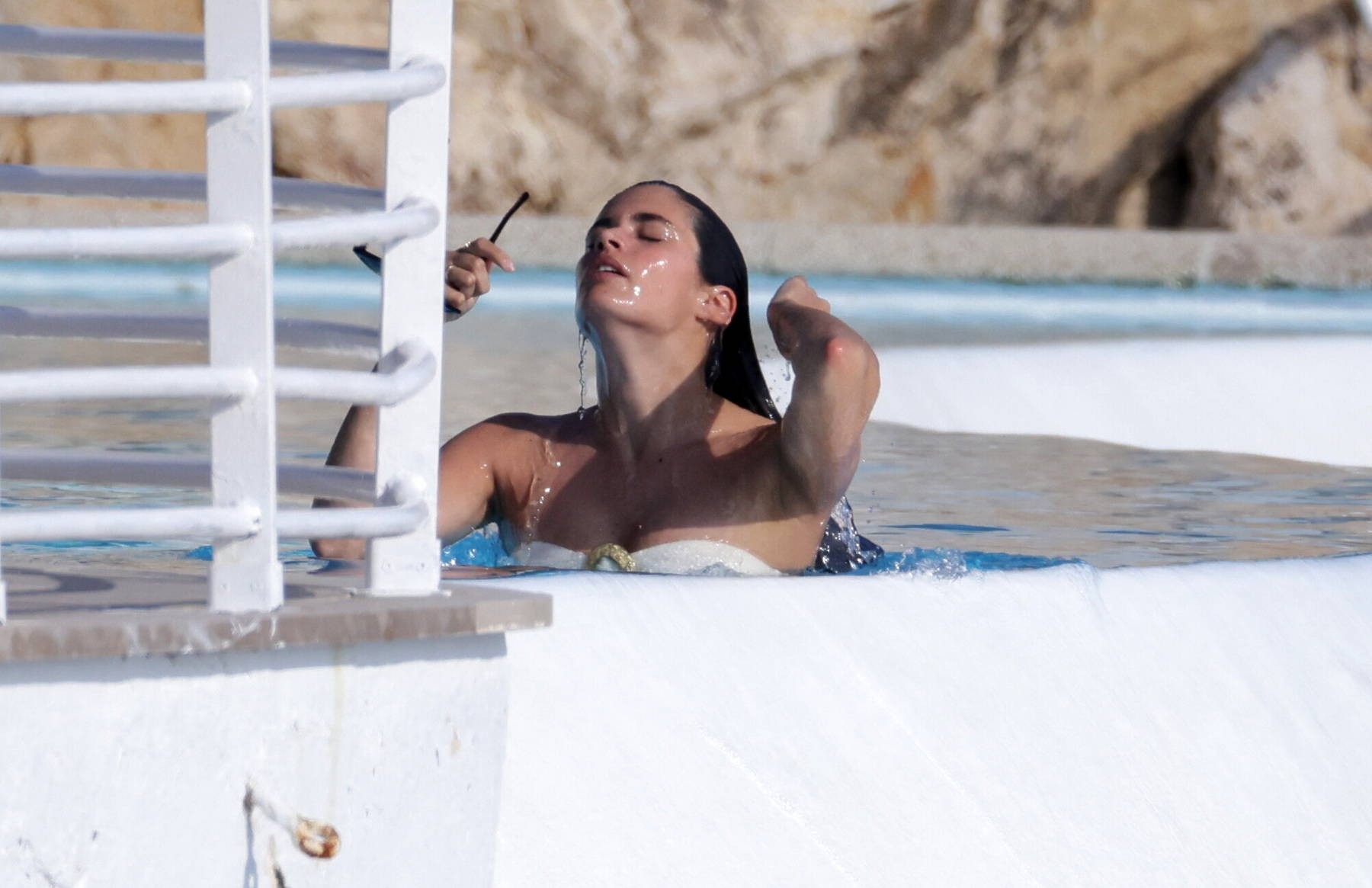Sara Sampaio spotted in a bikini while enjoying some pool time at