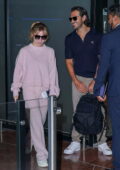 Sydney Sweeney looks cute in a pink sweatsuit as she arrives for a flight out of Nice Airport, France