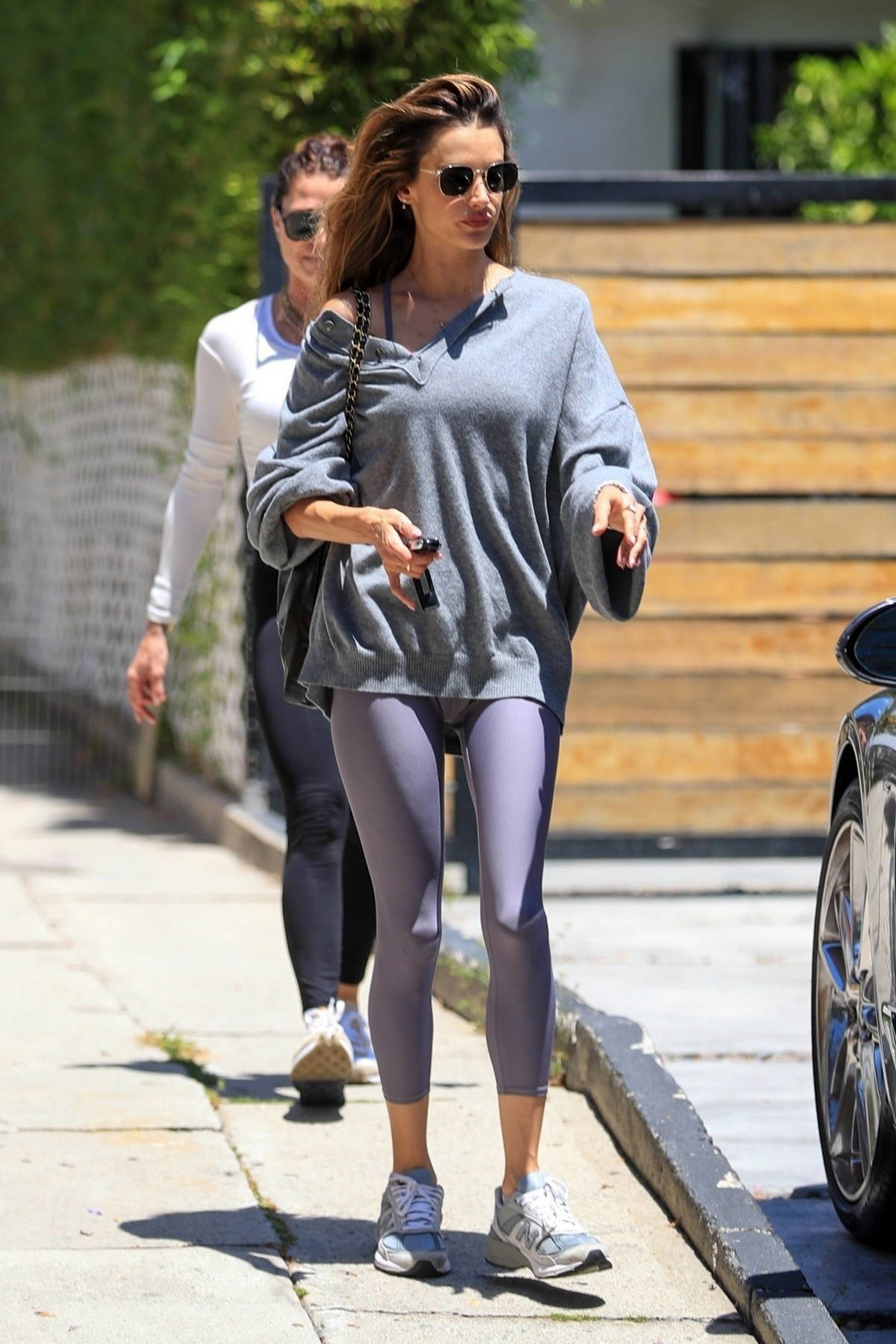 https://www.celebsfirst.com/wp-content/uploads/2023/06/Alessandra-Ambrosio-looks-stunning-in-an-oversized-grey-sweater-and-lavender-leggings-while-leaving-a-gym-in-West-Hollywood-California-200623_17.jpg
