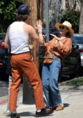 Elizabeth Olsen shares a few laughs with a friend while out for lunch at Little Dom's in Los Feliz, California