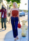 Elsa Hosk looks radiant in a red top paired with jeans as she attends the  FWRD