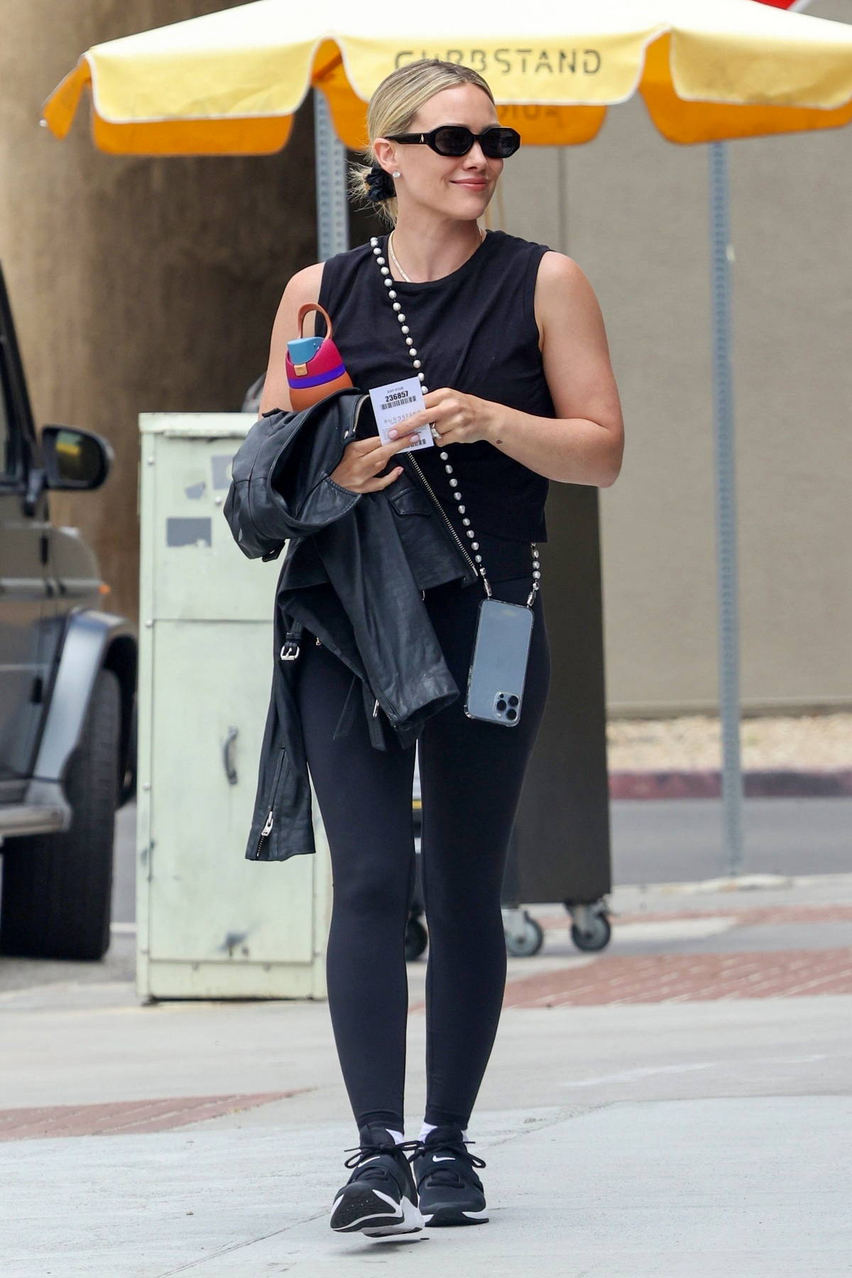 Hilary Duff sports a black top and leggings as she heads to the gym for her