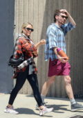 Hilary Duff wears a flannel shirt and leggings while stepping out