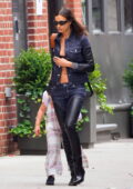 Irina Shayk rocks a stylish denim ensemble with thigh-high boots while out running errands in New York City