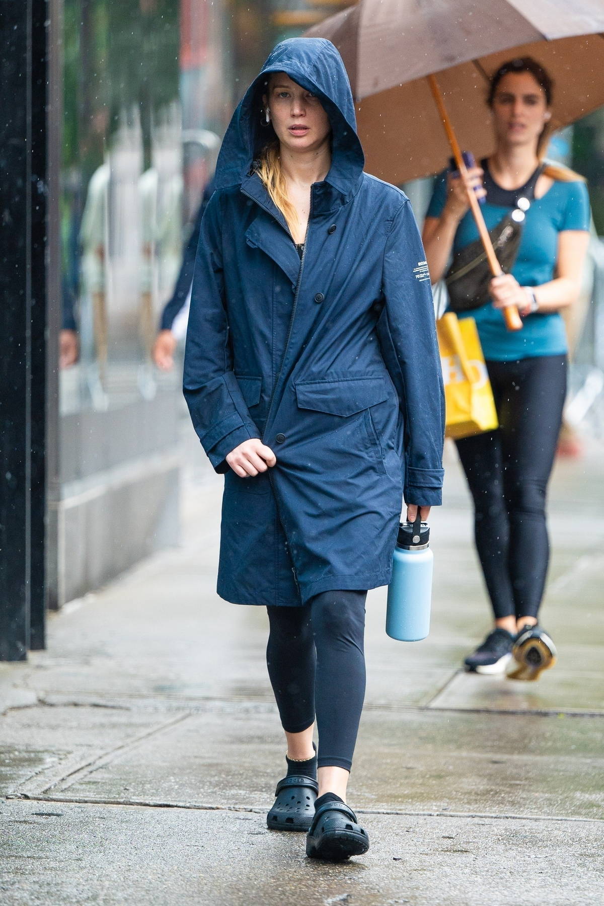 Jennifer Lawrence braves the rain in a hooded coat and leggings while out  in New York City-270623_4