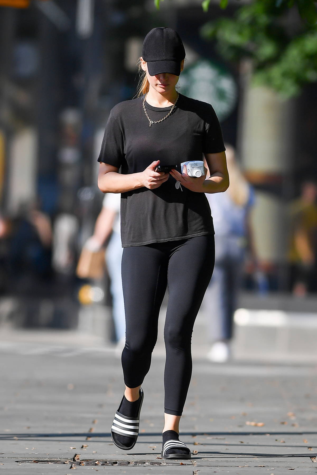 Jennifer Lawrence wears a black t-shirt with matching leggings