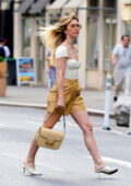 Julianne Hough rocks a pair of tan leather shorts and a low-cut white top while stepping out in New York City