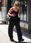 Noomi Rapace wears a black camisole with matching trousers while out with friends in London, UK