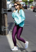 Olivia Wilde dons a blue sweatshirt and purple leggings as she