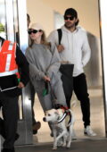 Sydney Sweeney keeps it comfy in grey sweatsuit as she touches down at LAX with fiancé Jonathan Davino and her dog in Los Angeles