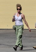 Denise Richards dons a white tank top and green cargo pants while picking up an U-Haul full of furniture in Los Angeles