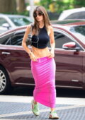 Emily Ratajkowski shows off her killer abs in a black crop top and pink skirt while arriving at Sony Music Studios in New York City