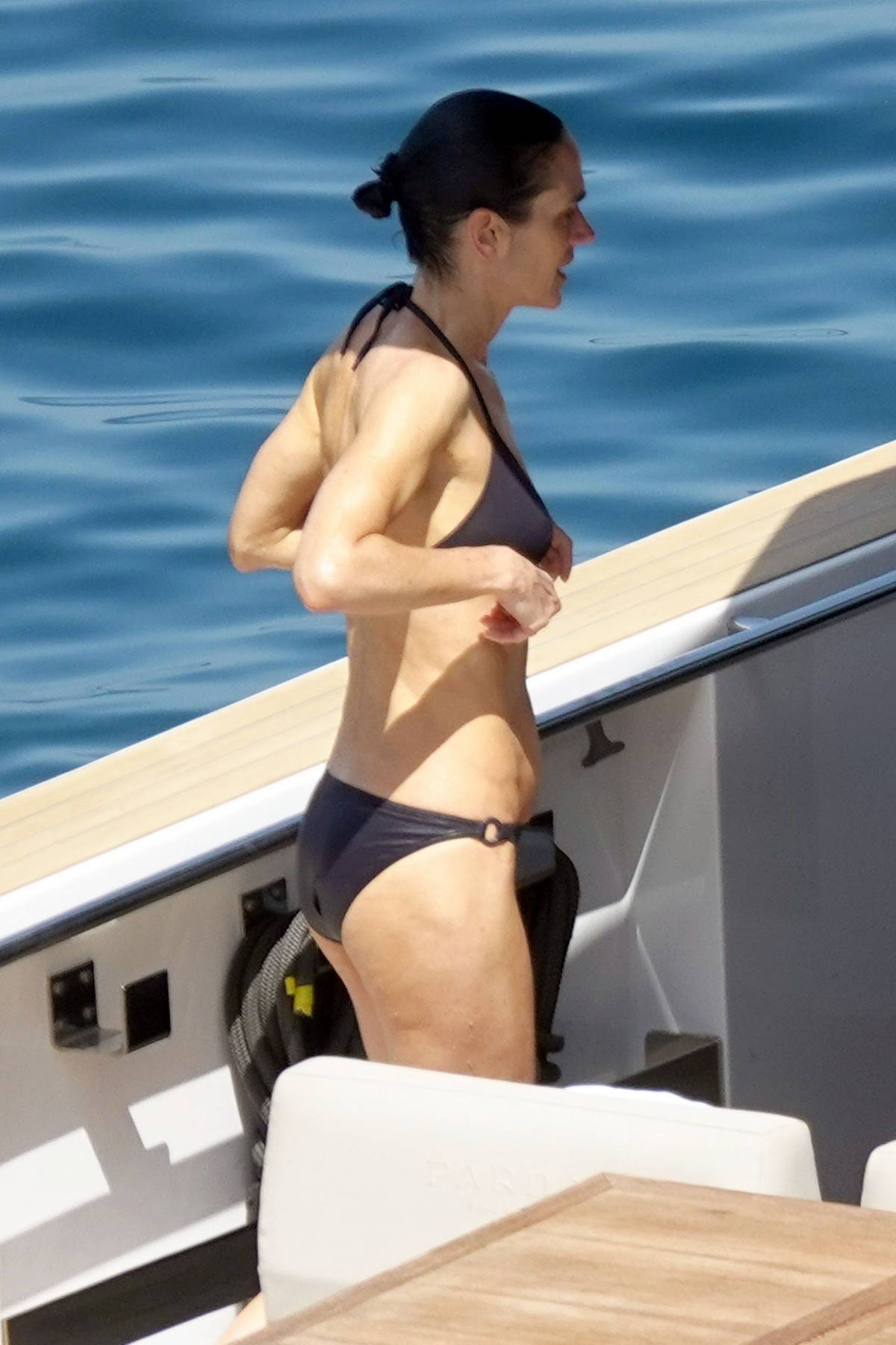 Jennifer Connelly stuns in a black bikini while relaxing on a