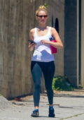 Jennifer Lawrence looks fit in a white tank top and black leggings as she heads for a Pilates class in Los Angeles