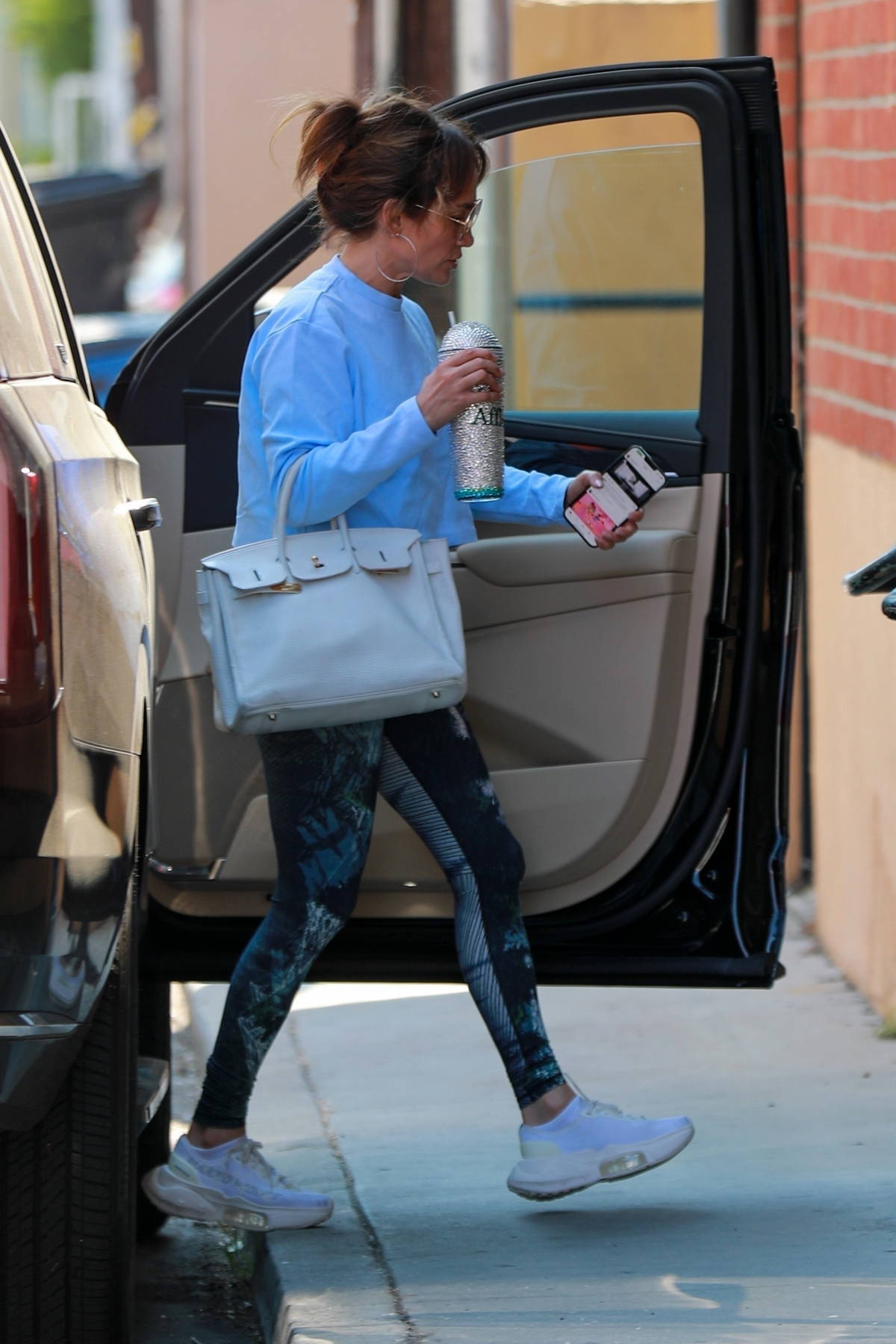 julianne looks great in a white crop top and light blue leggings as she  steps out after lunch in los angeles-240819_1