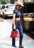 Kendall Jenner looks fab in a navy crop top and jeans while she