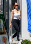 Minka Kelly shows off her fabulous figure in a white tank top and black leggings while she leaves the gym in Los Angeles