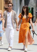 Nina Dobrev looks radiant in an orange summer dress while enjoying a stroll with beau Shaun White in SoHo, New York City