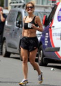 Rita Ora showcases her amazing abs in a black sports bra and shorts while leaving after a workout session in London, UK