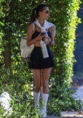Alessandra Ambrosio looks fabulous in a black tennis skirt with a