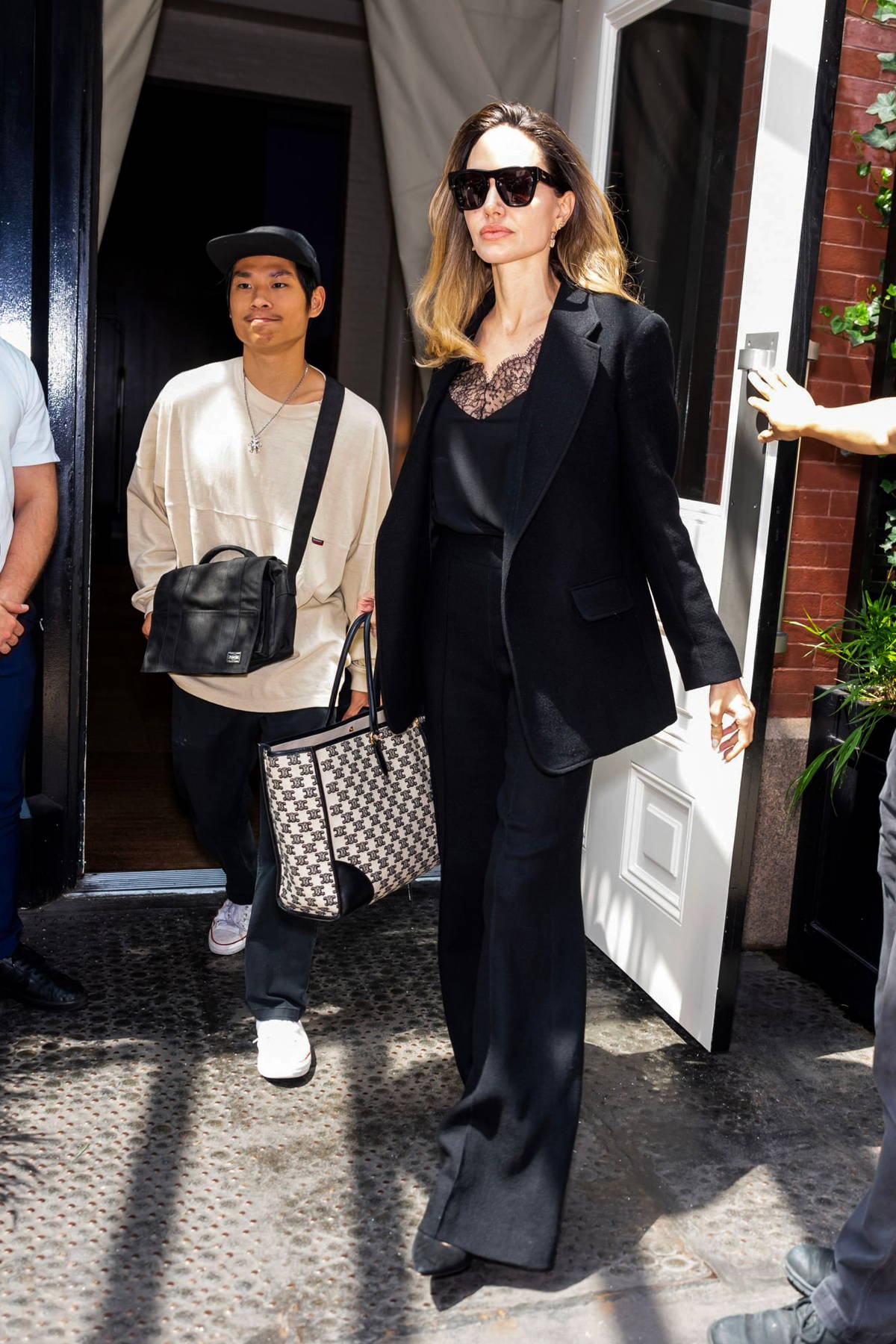 Angelina Jolie looks classy as ever in black pantsuit while stepping out  for a business meeting with her son Pax in New York City-160834_8
