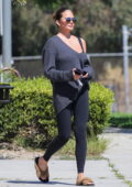 Chrissy Teigen wears an off-the-shoulder sweater and black leggings as she takes her kids to a summer camp in Los Angeles