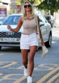 Christine McGuinness rocks a skintight tank top and white denim shorts while visiting a hair Salon in Alderley Edge, Cheshire, UK