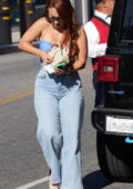 Francia Raisa wears a strapless top and jeans while out for lunch