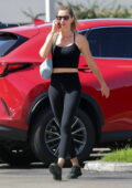 Gisele Bundchen showcases her fit physique in a black crop top and leggings as she leaves the gym in Miami, Florida