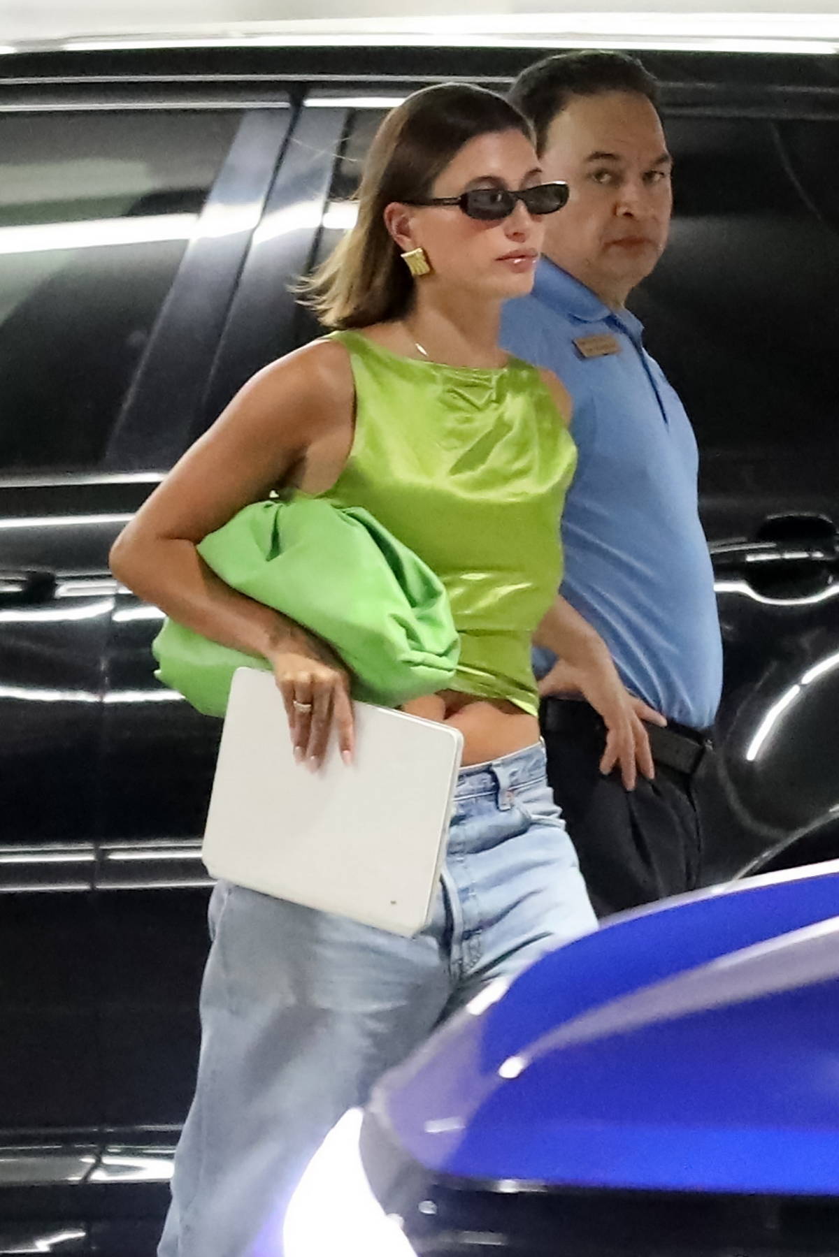 Hailey Bieber heads to a meeting in a neon green Prada crop top and  matching Bottega Veneta bag in Beverly Hills, California-140823_5