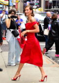 Hailey Bieber looks ravishing in a red dress as she makes her way into the 'Good Morning America' Studios in New York City