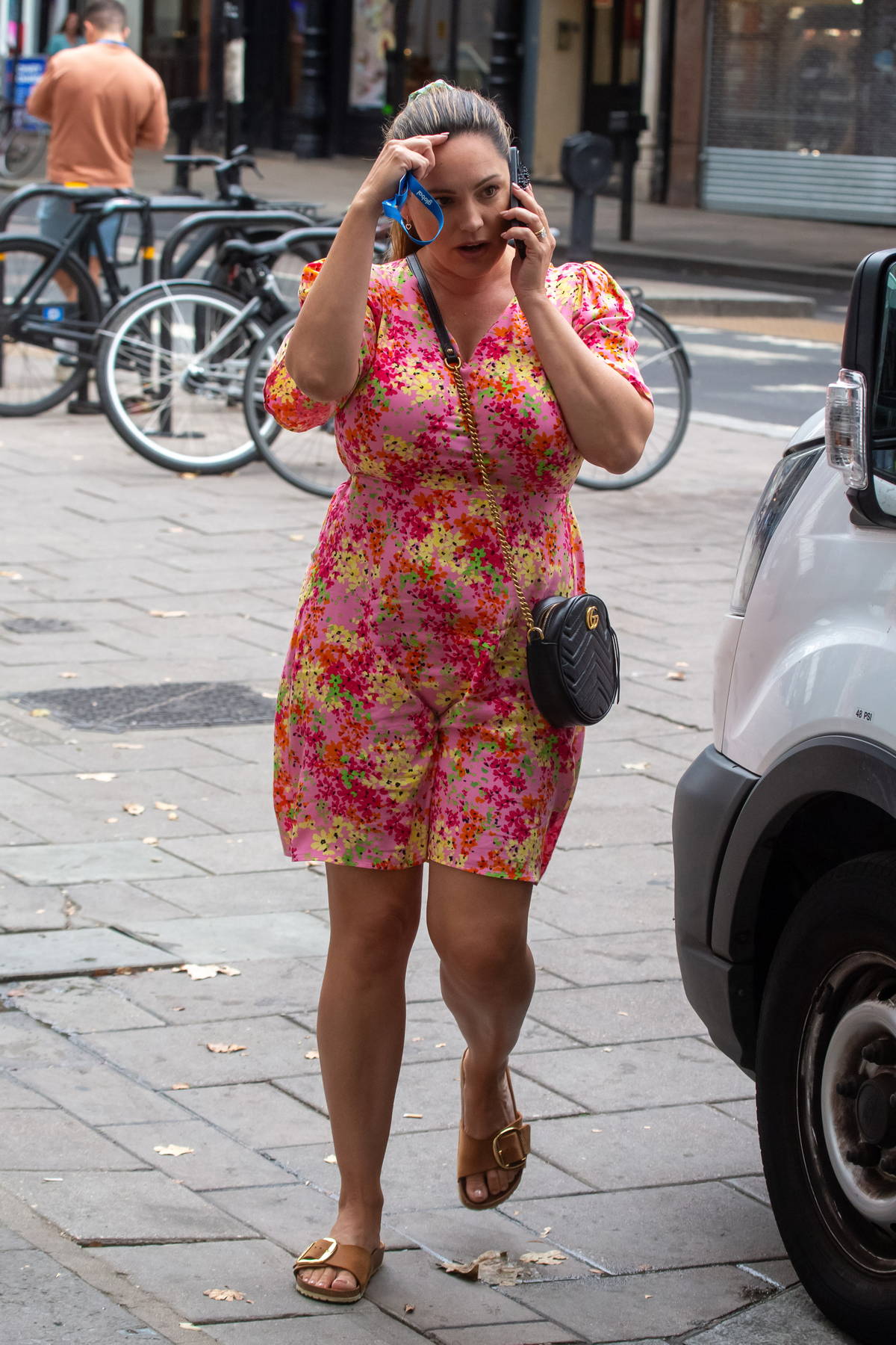 Kelly Brook looks pretty in a pink floral print dress while spotted outside the Global Radio Studios in London, UK