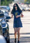 Krysten Ritter wears a blue tee and denim mini skirt while she takes her son out for frozen yogurt in Studio City, California
