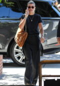 Sofia Richie chats on the phone while matching her tones of black as she heads to lunch at South Beverly Grill in Beverly Hills, California