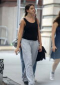 Suri Cruise wears a black tank top and grey sweatpants while out on a stroll with friends in SoHo, New York City