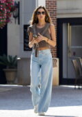 Alessandra Ambrosio looks casually chic in a brown tank top and flared denim while out on a stroll in Beverly Hills, California