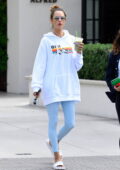 Alessandra Ambrosio looks radiant in an oversized white hoodie and baby blue leggings while grabbing a smoothie in Malibu, California
