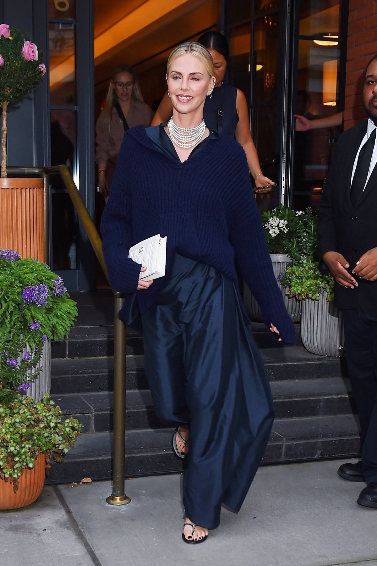 Charlize Theron goes casual chic in navy blue at celebrity hotspot
