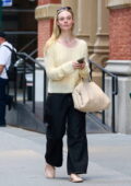 Elle Fanning goes make-up free in an yellow top and black denim while visiting ‘FaceGym’ in New York City
