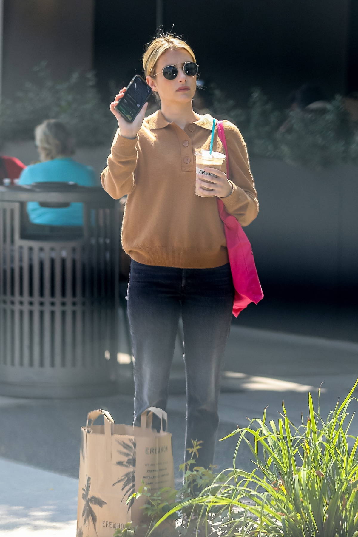 Emma Roberts carries a Barbie tote while getting some fresh groceries at  Erewhon Market in Los