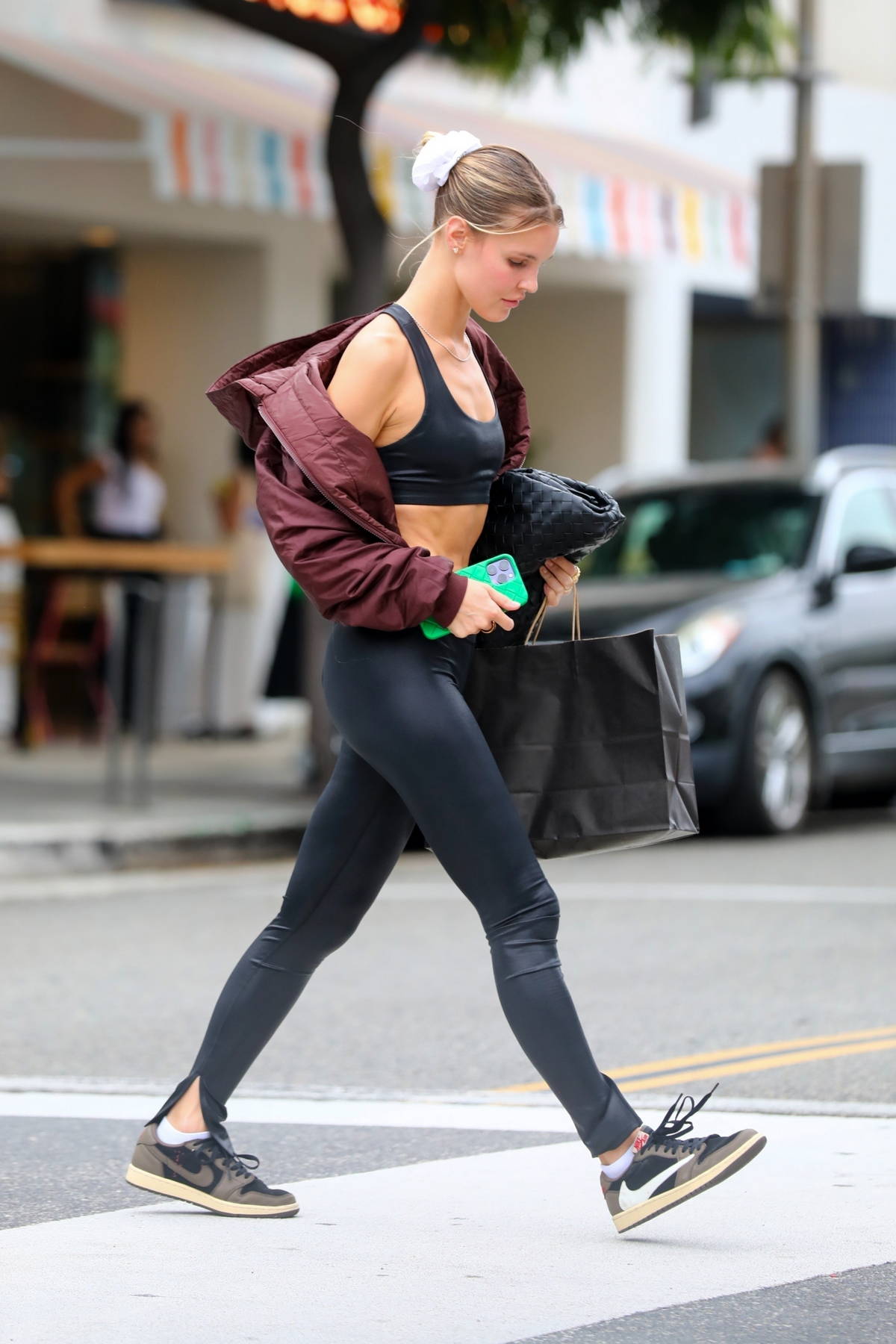 Joy Corrigan shows off her svelte figure in a black sports bra and leggings  while out shopping in Beverly Hills, California