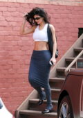 Kylie Jenner looks ravishing in a midriff baring crop top and a grey skirt while stepping out in Beverly Hills, California