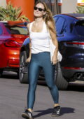 Olivia Wilde looks fabulous in a white tank top and teal-blue leggings as she hits the gym in Studio City, California