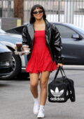 Xochitl Gomez wears a red mini dress with black leather jacket while spotted outside the DWTS rehearsals in Los Angeles