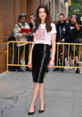 Anne Hathaway cuts a stylish figure in a black leather skirt while posing outside ABC Studios in New York City
